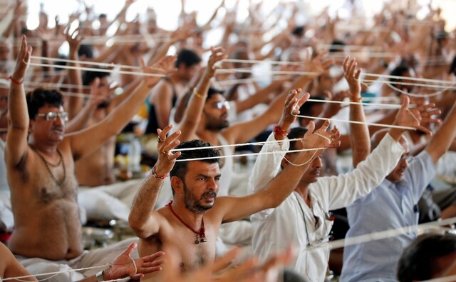 With the holy thread wound in the palms of their hands, devotees chant prayers to honour their ancestors on the day of Mahalaya in Ahmedabad. One of the legends of the 15-day mourning period can be traced in the epic Mahabharata in which Karna on reaching heaven was granted a fortnight on earth by the Lord Indra to offer prayers to his ancestors. Reuters/ Amit Dave With the holy thread wound in the palms of their hands, devotees chant prayers to honour their ancestors on the day of Mahalaya in Ahmedabad. One of the legends of the 15-day mourning period can be traced in the epic Mahabharata in which Karna on reaching heaven was granted a fortnight on earth by the Lord Indra to offer prayers to his ancestors. Reuters/ Amit Dave